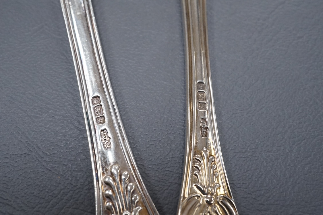 A harlequin part canteen of late 19th/early 20th century silver King's pattern flat ware, comprising eight table spoons, nine dessert spoons, two table forks, one dessert fork and two coffee spoons, by James Dixon & Sons